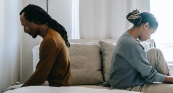 two people sitting apart vs a part