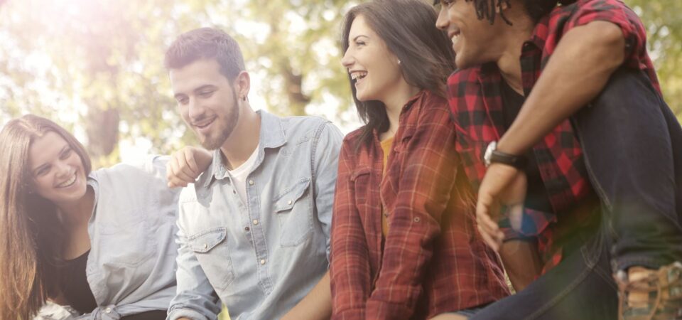 friends laughing sharing top tips to learn english