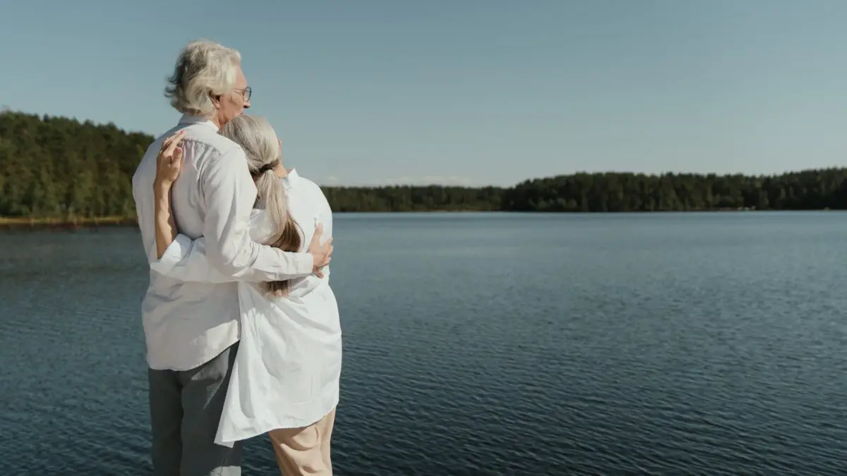 a mature couple standing by a lake contemplating idioms vs proverbs