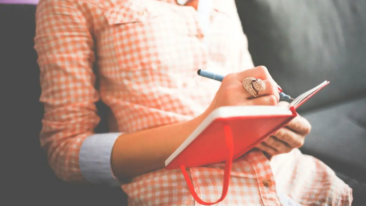 woman checking for common writing mistakes in written English