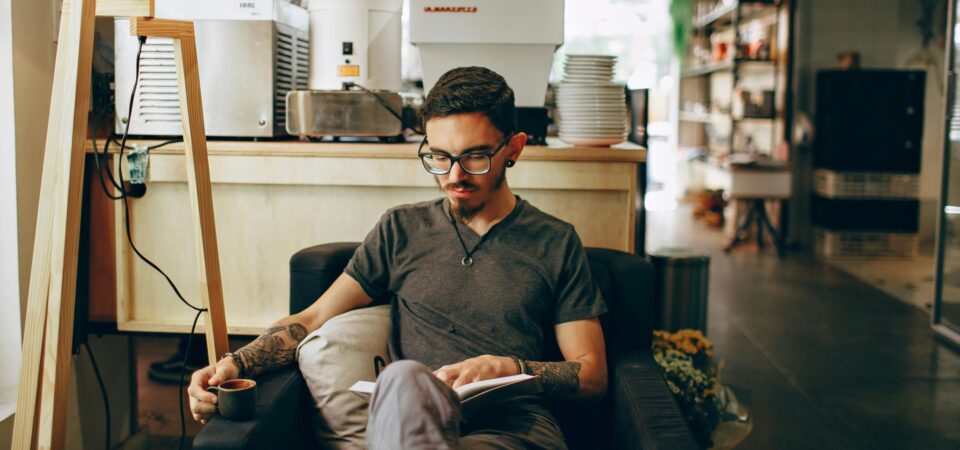 man trying to learn english by reading