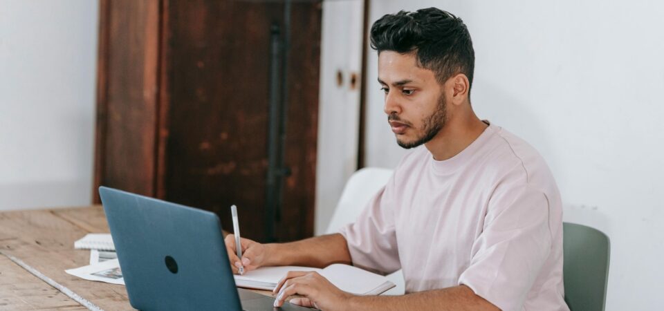 man studying to advance ESL levels